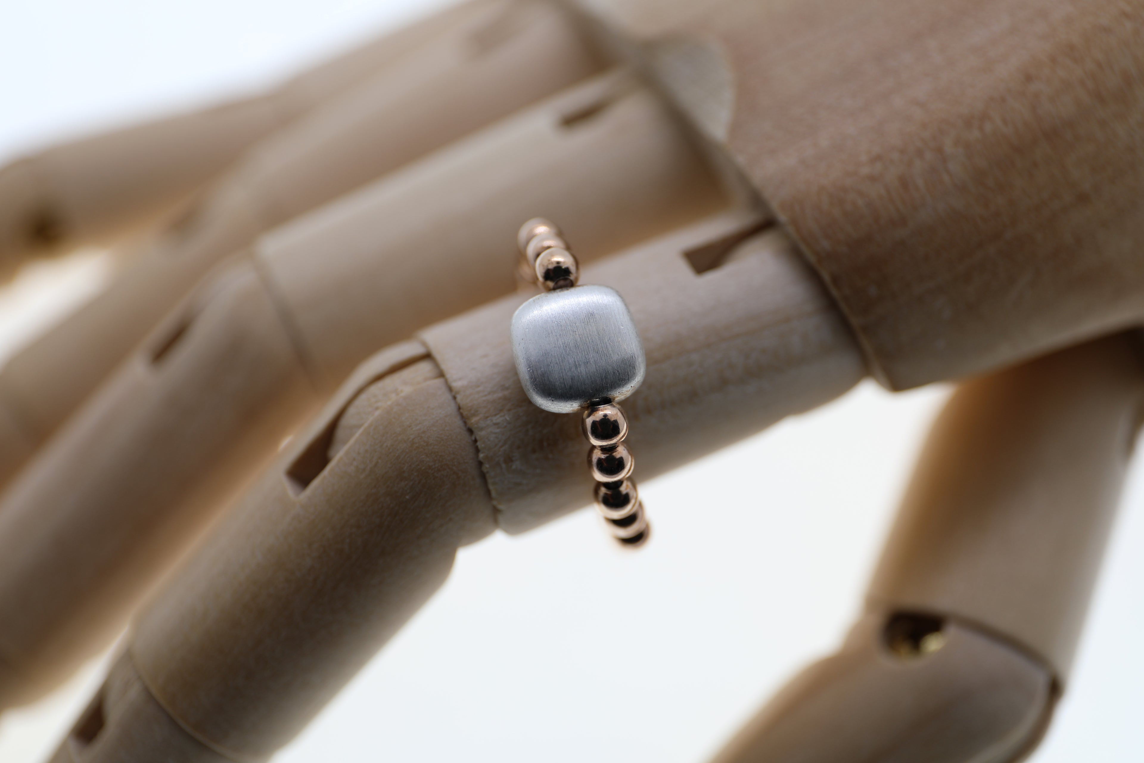 Rosé vergoldete Silberkugeln mit Silberelement